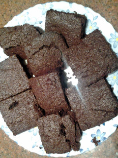 A picture of Chewy brownies with cocoa powder.