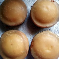 A picture of cupcakes with brown sugar icing.
