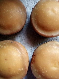 A picture of cupcakes with brown sugar icing.