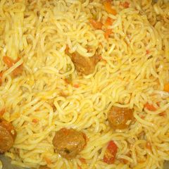 A picture of Fried sausages in noodles.