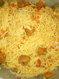 A picture of Fried sausages in noodles.
