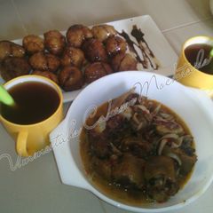 A picture of Special Puff puff, cow tail pepper soup and tea.