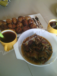 A picture of Special Puff puff, cow tail pepper soup and tea.