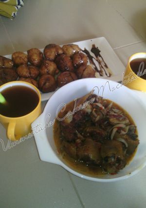 A picture of Special Puff puff, cow tail pepper soup and tea.