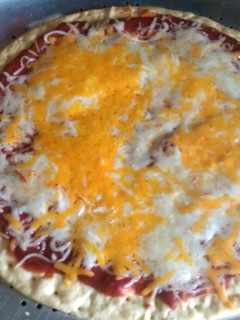 A picture of 3 cheese pizza.