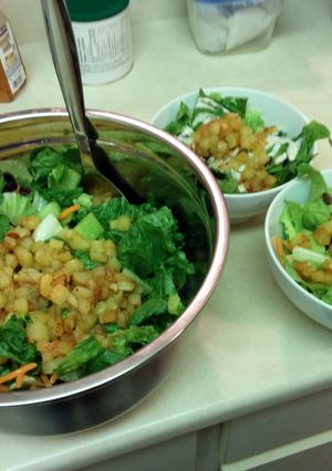 A picture of Salad with Hash Browns.