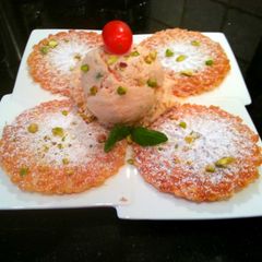 A picture of Tantalizing Tomato Gelato w/Basil, Pistachio Nuts & Pizzellis.