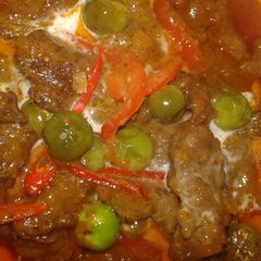 A picture of Panang beef or beef in red curry peanuts sauce.