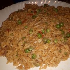 A picture of Simple fried rice and peas.