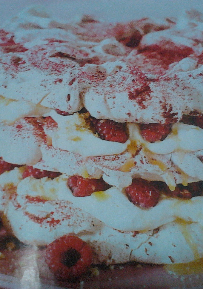A picture of Raspberry meringue stack cake.