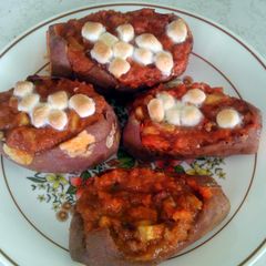 A picture of Apple and pecan stuffed /baked sweet potatoes.