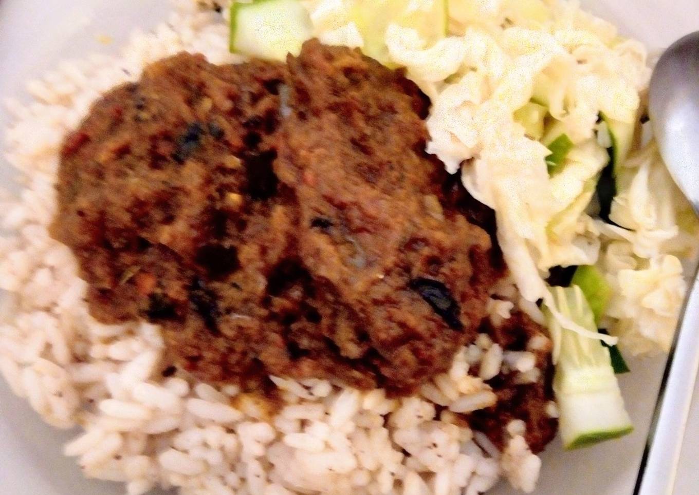 Cinnamon-Coconut flavored local(ofada) rice with goat meat stew