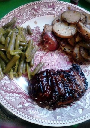 A picture of Bacon Wrapped Bacon Fried BBQ'D Pork Chops.