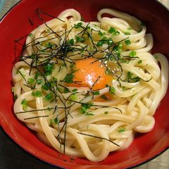 A picture of Hot Udon Noodles with Raw Egg.
