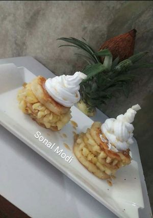 A picture of Pineapple pancakes with maple syrup.