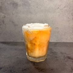 A picture of Cocochino (Cold Brew With Coconut Water) With Ice.
