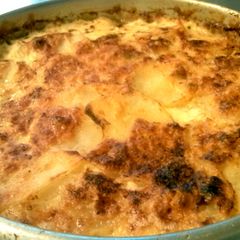 A picture of Potatoes Dauphinoise- Bomb Cheesey Baked Potatoes!.