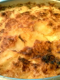 A picture of Potatoes Dauphinoise- Bomb Cheesey Baked Potatoes!.