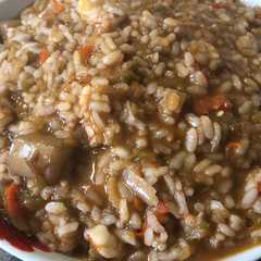 Una foto de Arroz meloso con sepia y gambones