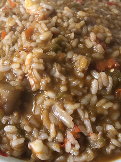 Una foto de Arroz meloso con sepia y gambones