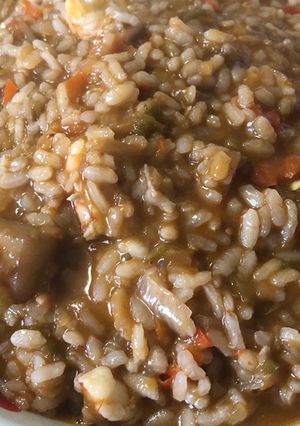 Una foto de Arroz meloso con sepia y gambones