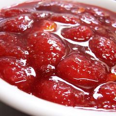 A picture of Strawberry Confiture Jam with Fresh Strawberries.