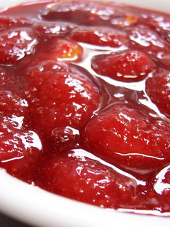 A picture of Strawberry Confiture Jam with Fresh Strawberries.