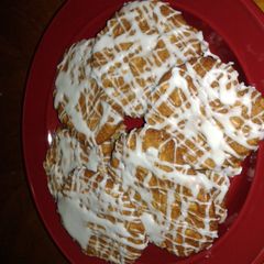 A picture of oatmeal cookies with icing.