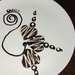 A picture of Homemade dry fruits and bounty chocolate.