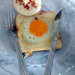 A picture of Sunny side up with bread.