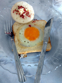 A picture of Sunny side up with bread.