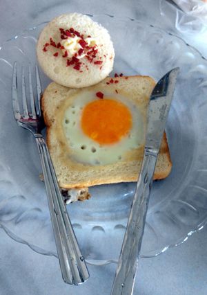 A picture of Sunny side up with bread.