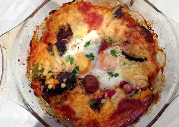 Baked eggs and aubergine in spicy sauce