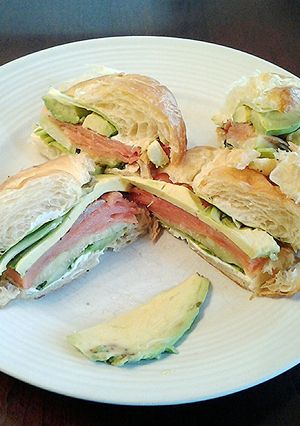 A picture of Avocado and Smoked Salmon Croissant Sandwich.
