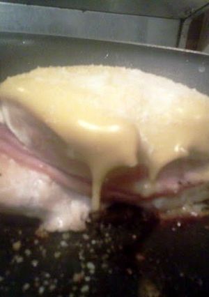 A picture of ham stuffed chicken.