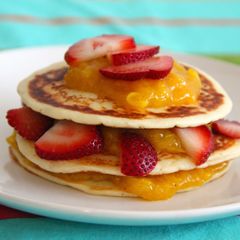 Yogurt pancakes with cinnamon mango coulis and strawberries A picture of Yogurt pancakes with cinnamon mango coulis and strawberries.