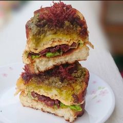 A picture of Scallop XO Sauce With Pesto And Sun Dried Tomato Sandwich.