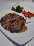 Beef steak with brown sauce and sauted vegetable