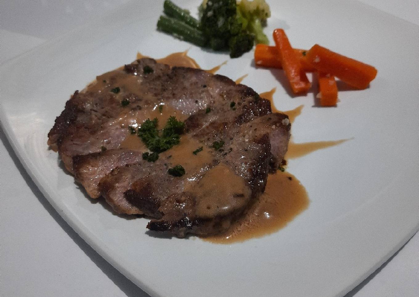 Beef steak with brown sauce and sauted vegetable