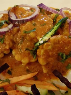 A picture of Corn with peanut powder.