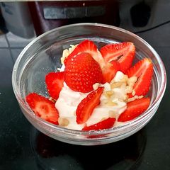 A picture of My Healthy Dessert. Greek yogurt & Sliced fresh 🍓+ Nuts.