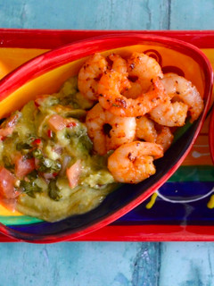 A picture of Cajun Prawns with Avocado.