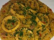 Una foto de arroz con calamares y azafran