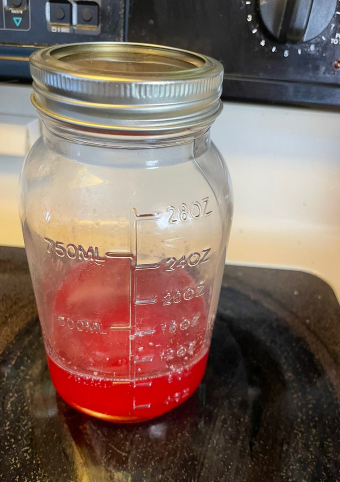A picture of Strawberry simple syrup.