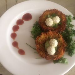 A picture of Potato nest with paneer egg.