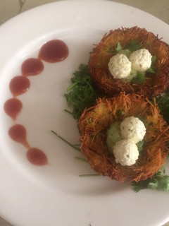 A picture of Potato nest with paneer egg.
