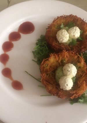 A picture of Potato nest with paneer egg.