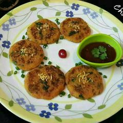 A picture of Papaya Patties with Tomato Sauce.