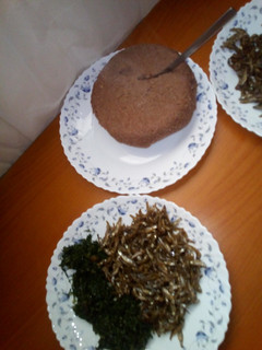 A picture of Brown ugali,omena and greens.