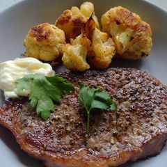 A picture of Grass-fed sirloin steak with roasted cauliflower.